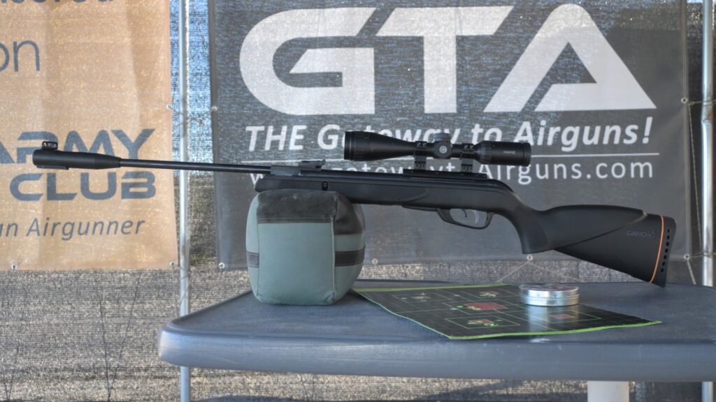 gamo scope upgrade showing air rifle and target grouping at range